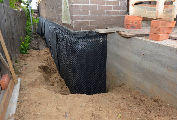 Happy homeowners after waterproofing job in Talladega